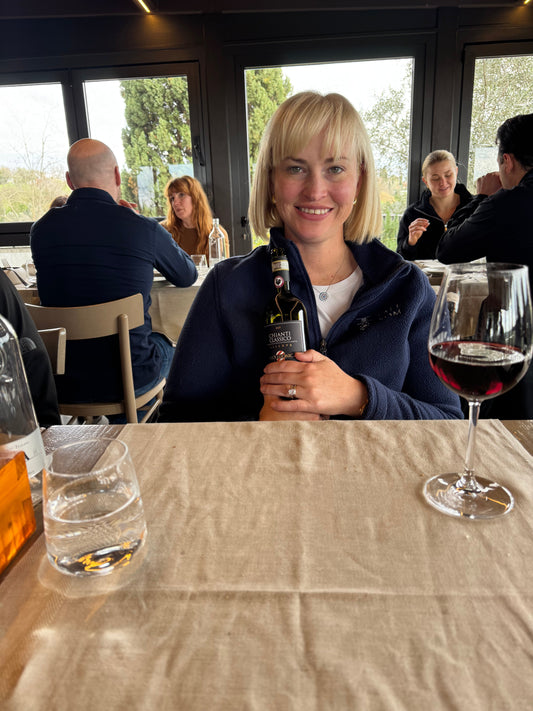 Woman holding bottle of wine